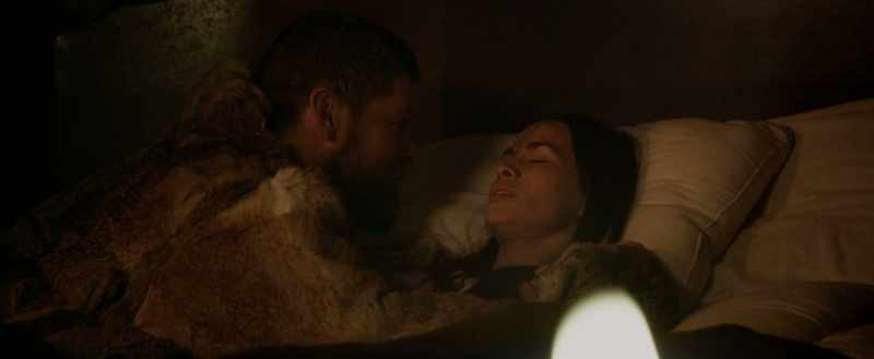 [woman singing softly]