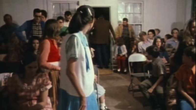 (WOMAN SPEAKING INDISTINCTLY)
