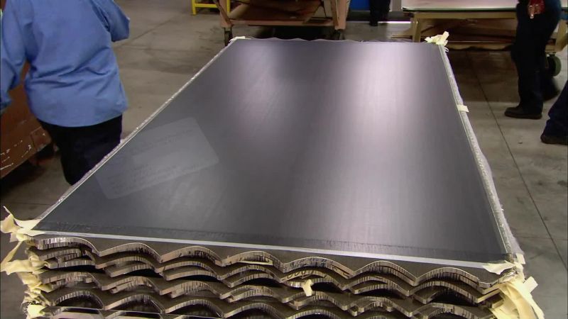 WORKERS SLAP ON LABELS