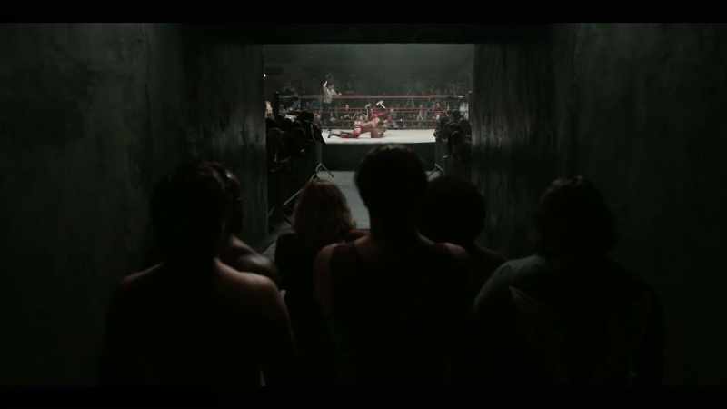 [wrestlers shout]